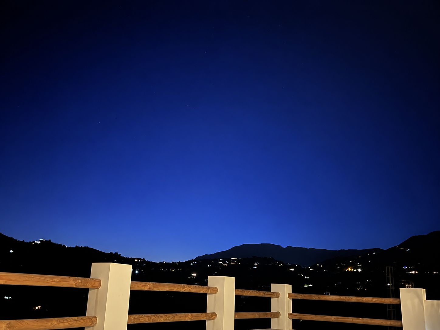 The terrace beneath an evening sky